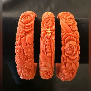 THREE beautiful,molded,celluloid bracelets.Collected for you.
OrangeCoral color